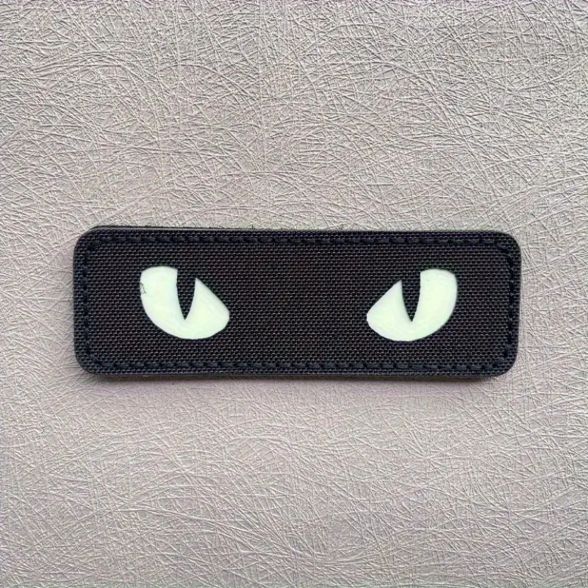 Kočičí oči na nášivce svítící - černé