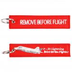 Přívěsek na klíče Fostex Remove before flight F-35 Lightning 2 - červený