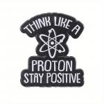 Odznak (pins) Protons Stay Positive 3 x 2,6 cm - čierny