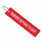 Prívesok na kľúče Bist Remove before flight - červený
