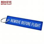Přívěsek na klíče Bist Remove before flight - modrý