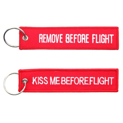 Přívěsek na klíče Fostex Remove before flight + Kiss me - červený
