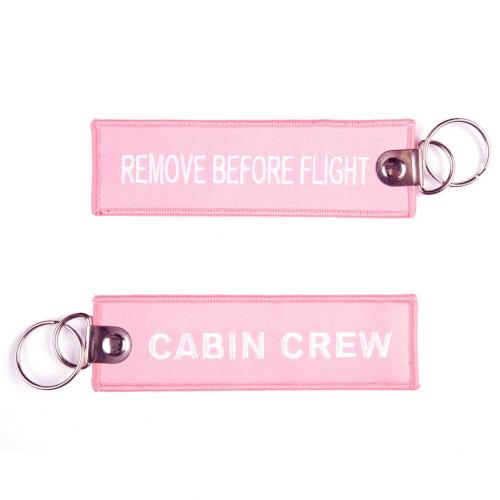 Přívěsek na klíče Fostex Remove before flight Cabin Crew - růžový